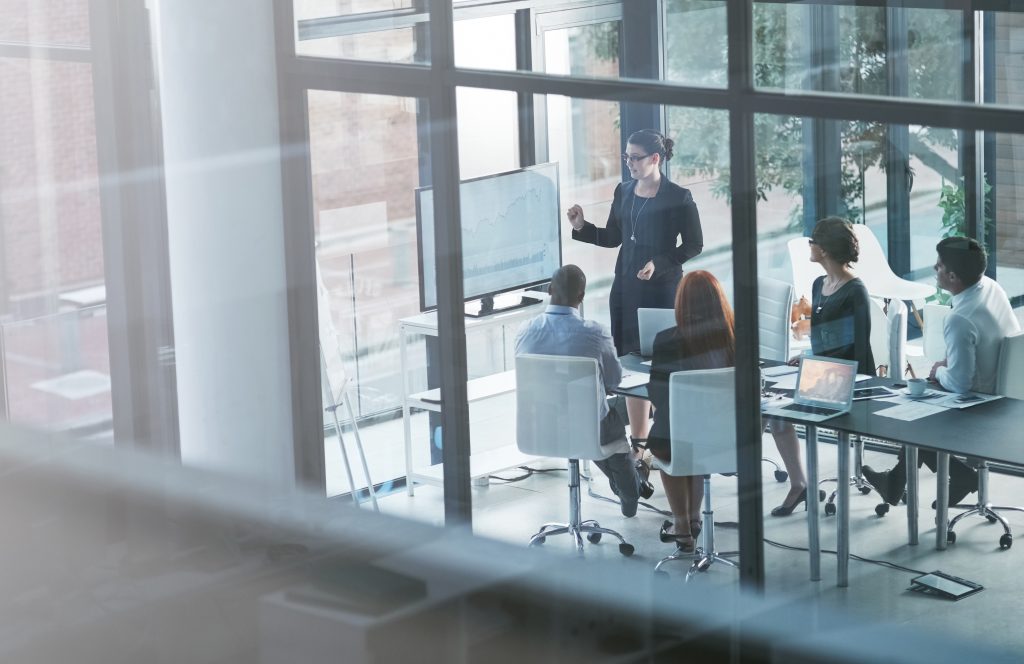 presenter teaching business people presentation sales report vision data analysis mentorship leadership group manager planning strategy screen monitor training meeting