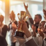 hand holding award cup with smiling happy crowd (2)